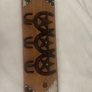 Horseshoe hat and belt rack on beautiful wood!
